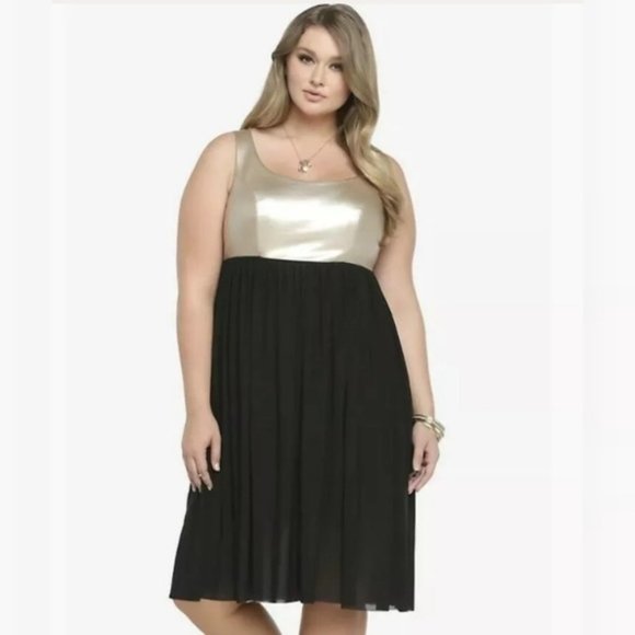 gold top black skirt